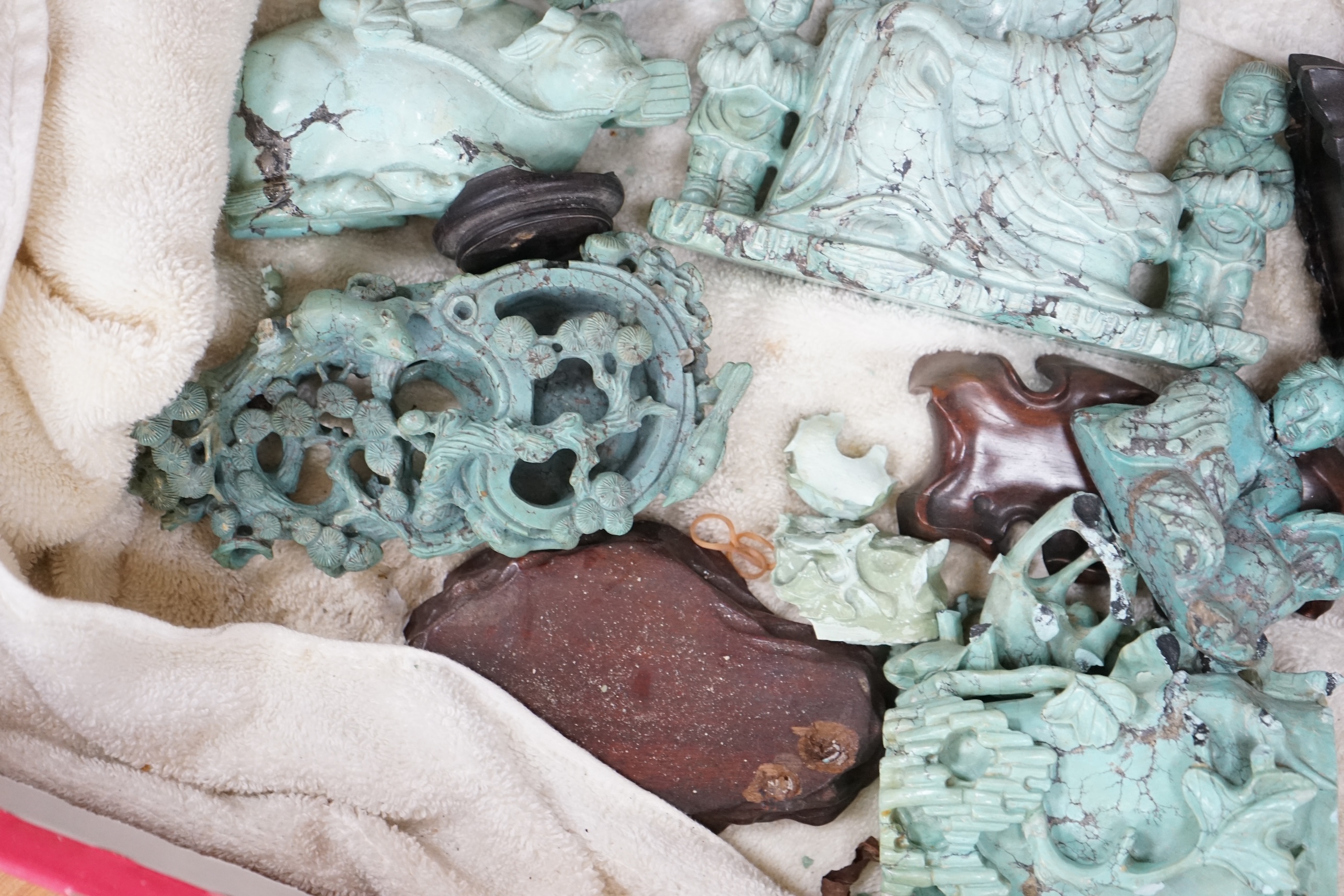 A group of Chinese turquoise matrix carvings, comprising a boy on a buffalo, 5.5in. a brushwasher, 7in. a vase and cover, 6.5in. a snuff bottle and a figure of a woman, 4.5in. (all a.f.)